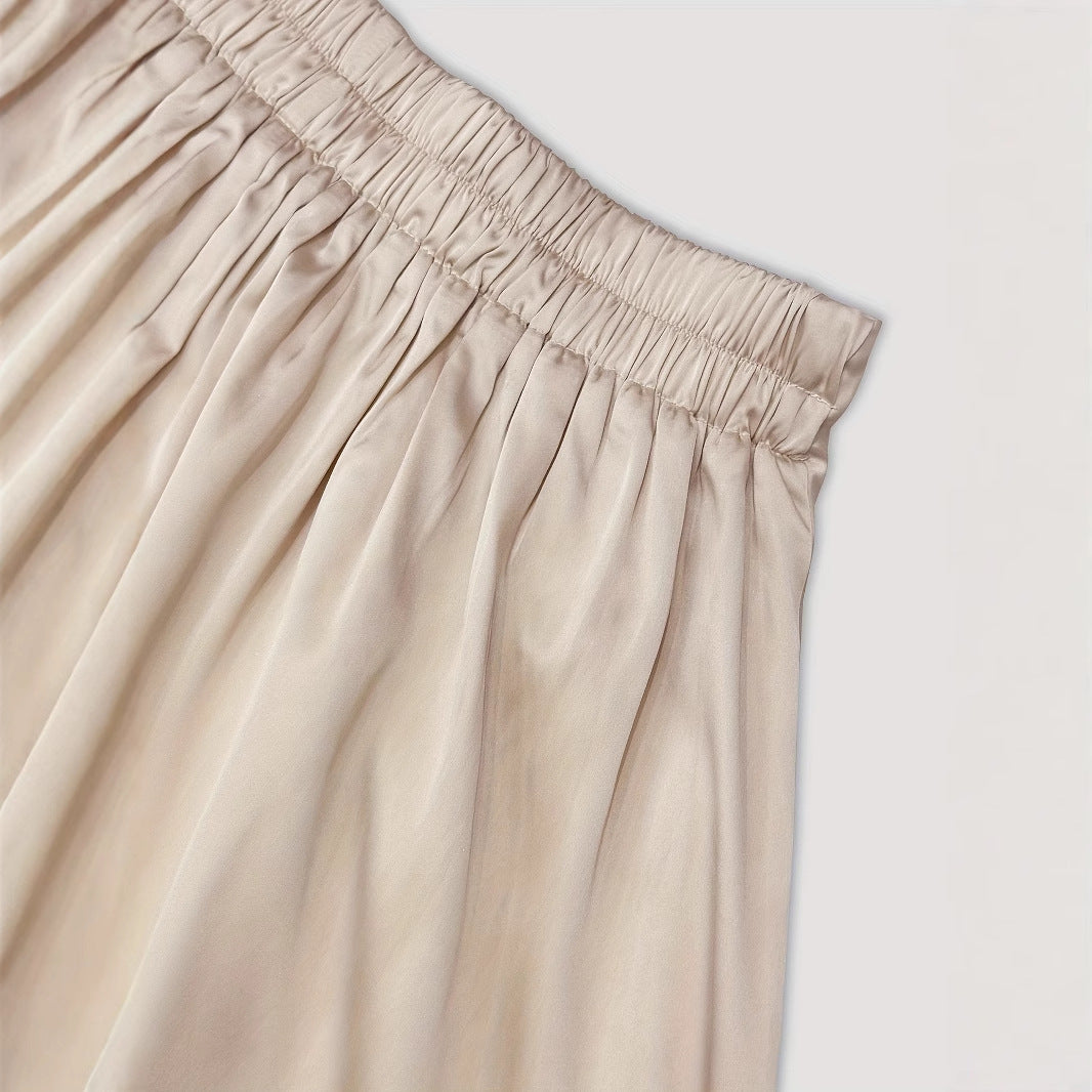 Sleeveless Scooped-neck Top Paired With A Pleated Skirt