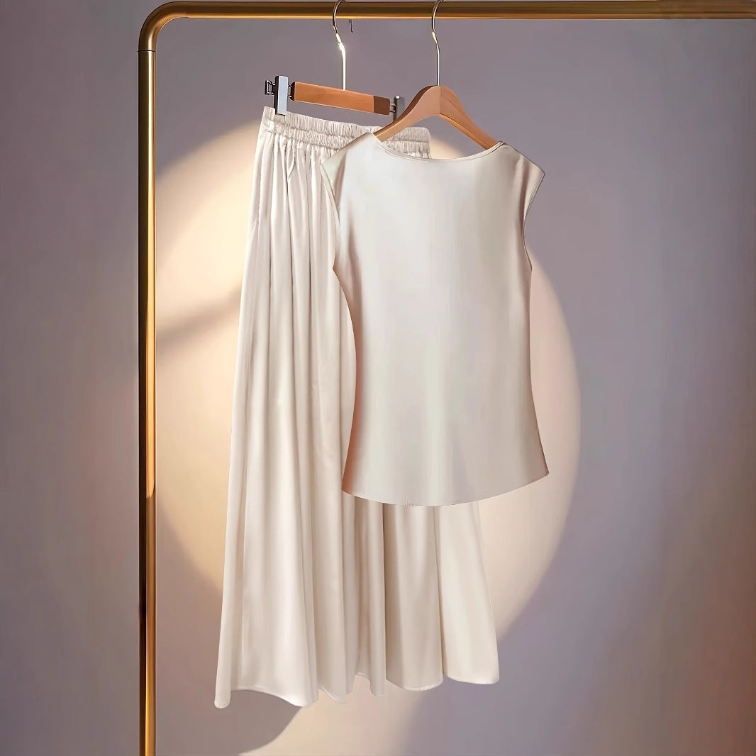 Sleeveless Scooped-neck Top Paired With A Pleated Skirt